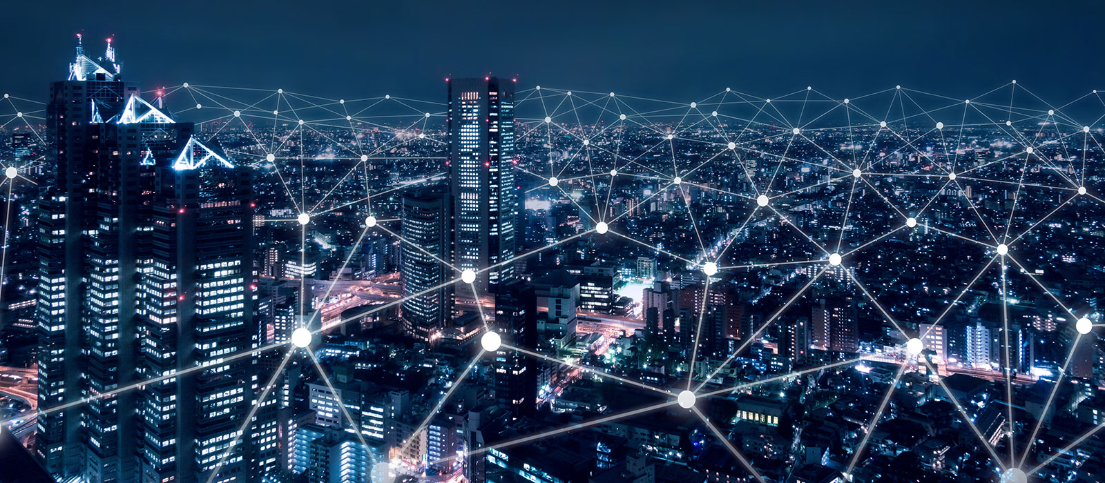 Night city scape with superimposed grid of dots and lines